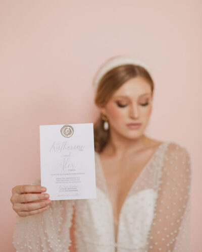 classic wedding invitation with bronze wax seal