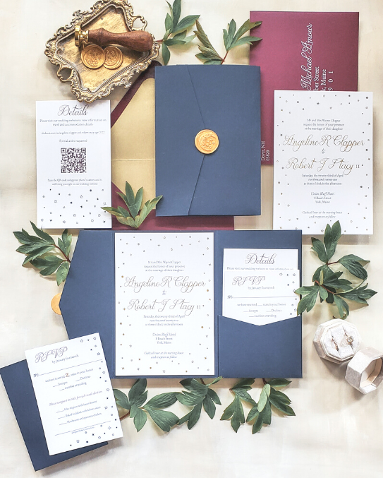 navy pocket with burgundy envelope wedding invitation star design with gold foil and wax seal