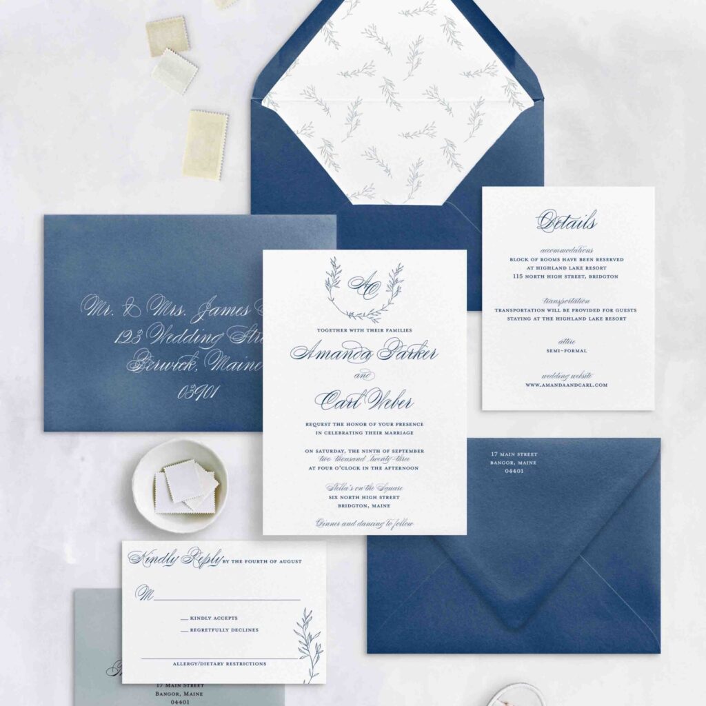 traditional and timeless invitation suite with monogram and laurel