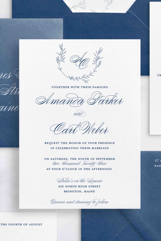 Traditional Invitation with a monogram and elegant calligraphy.