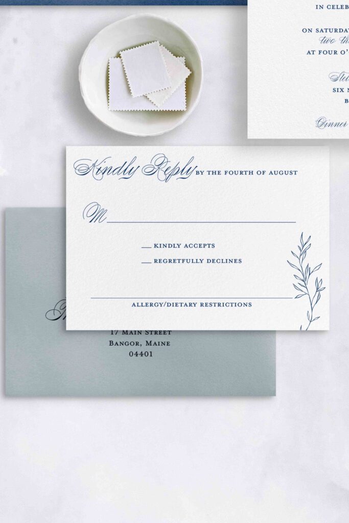 Traditional Invitation with a monogram and elegant calligraphy.