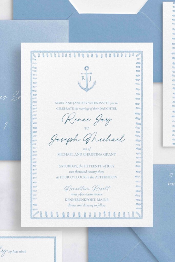 Nautical watercolor monogrammed invitation with seaside vibe and anchor envelope liner